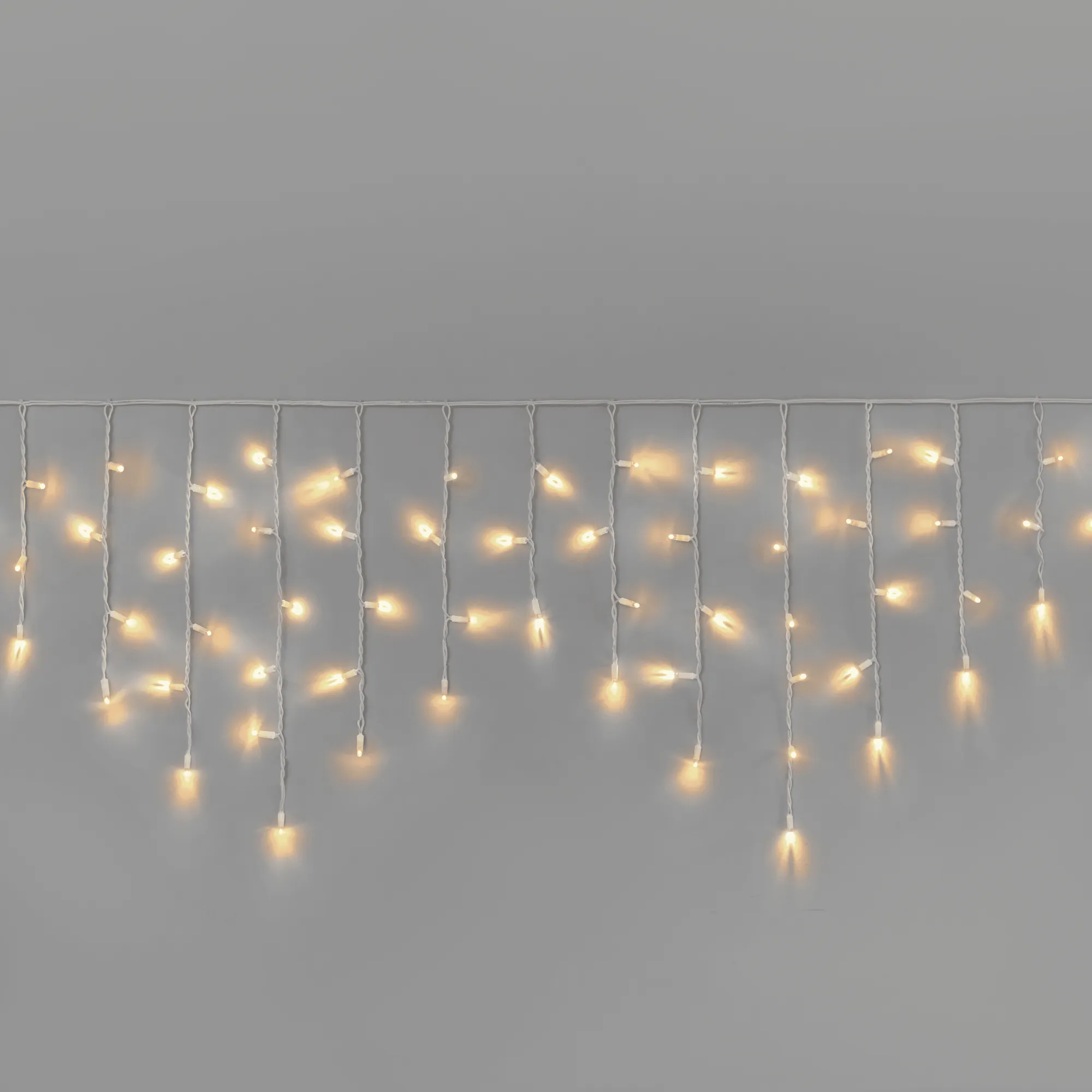 girljanda-bahroma-3-x-0-6-m-teplyj-belyj-220v-108-led-provod-belyj-kauchuk-ip65