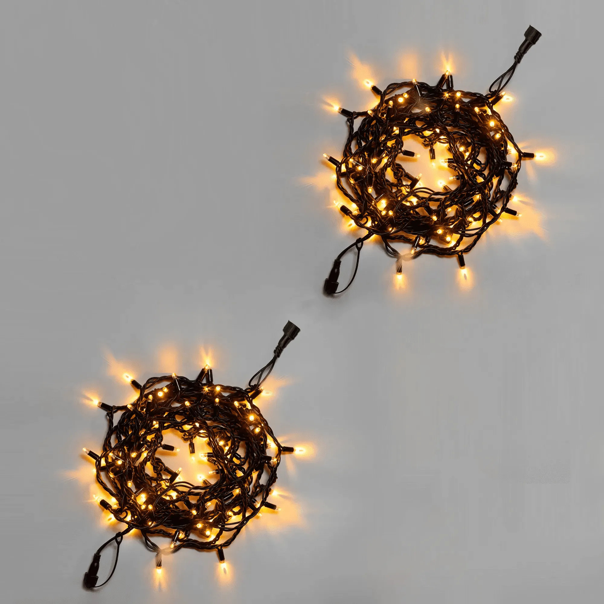 girljanda-nit-10-m-5-5-teplaja-belaja-mercajushhaja-tjoplym-belym-220-v-100-led-provod-chernyj-kauchuk-3-3-mm-ip65