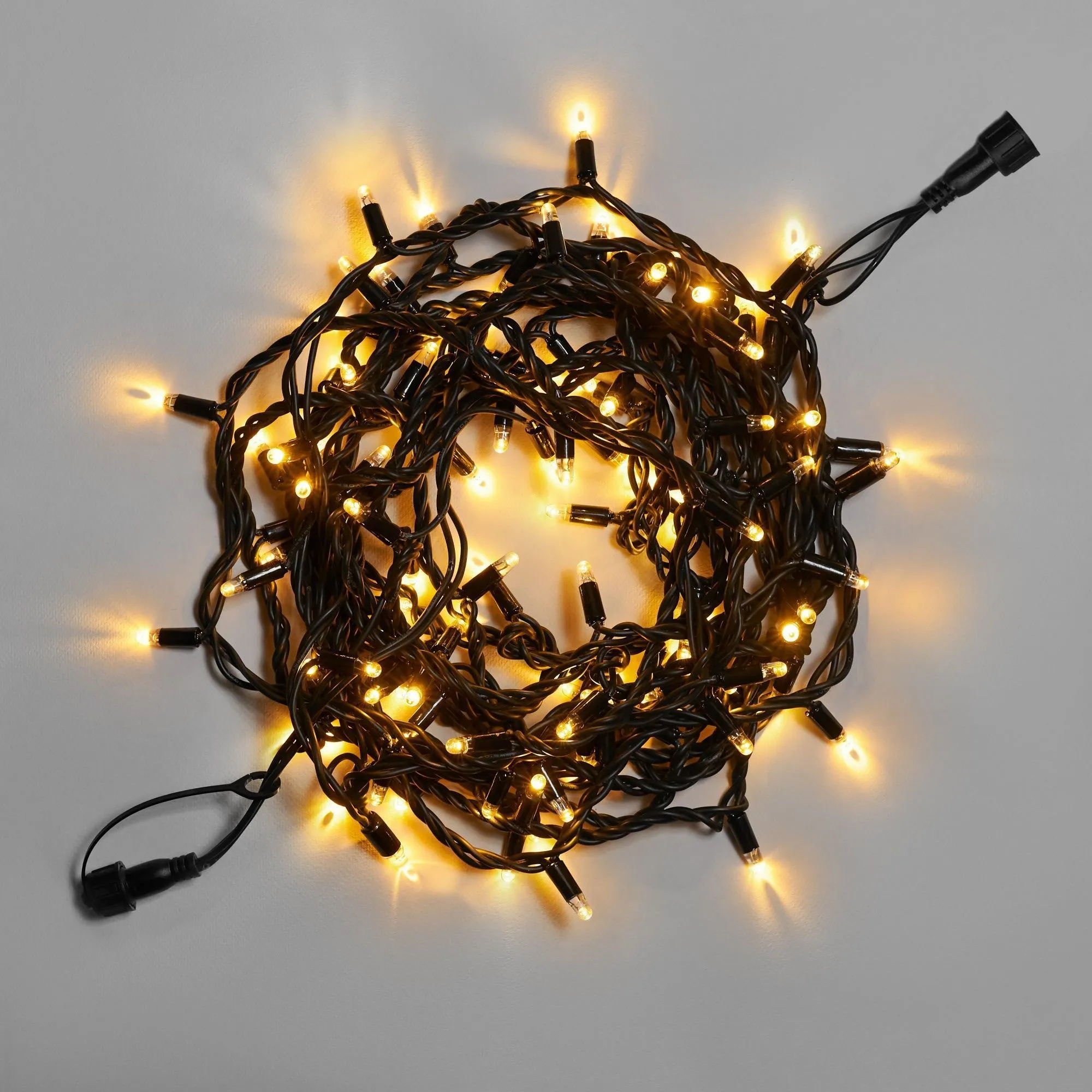 girljanda-nit-10-m-teplyj-belyj-24-v-100-led-provod-chernyj-kauchuk-3-3-mm-ip65